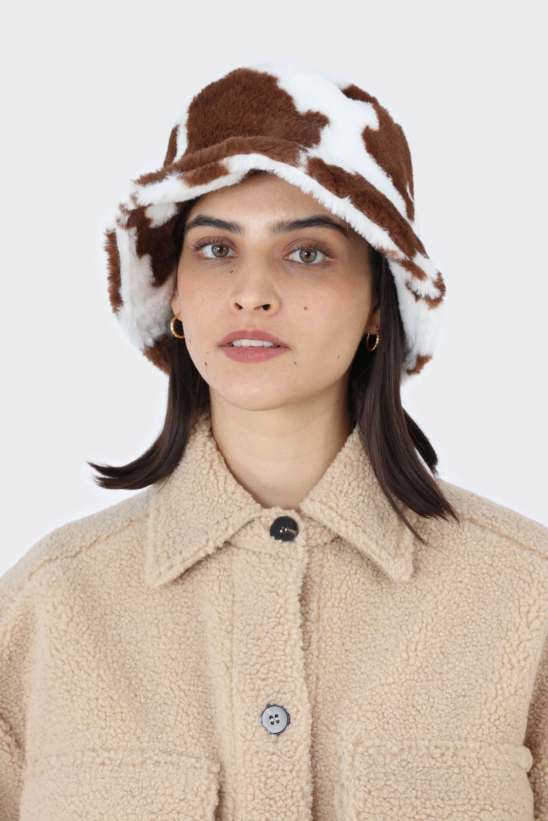 White and brown cow print faux fur bucket hat