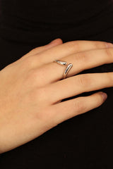 Silver colliding tear drops ring