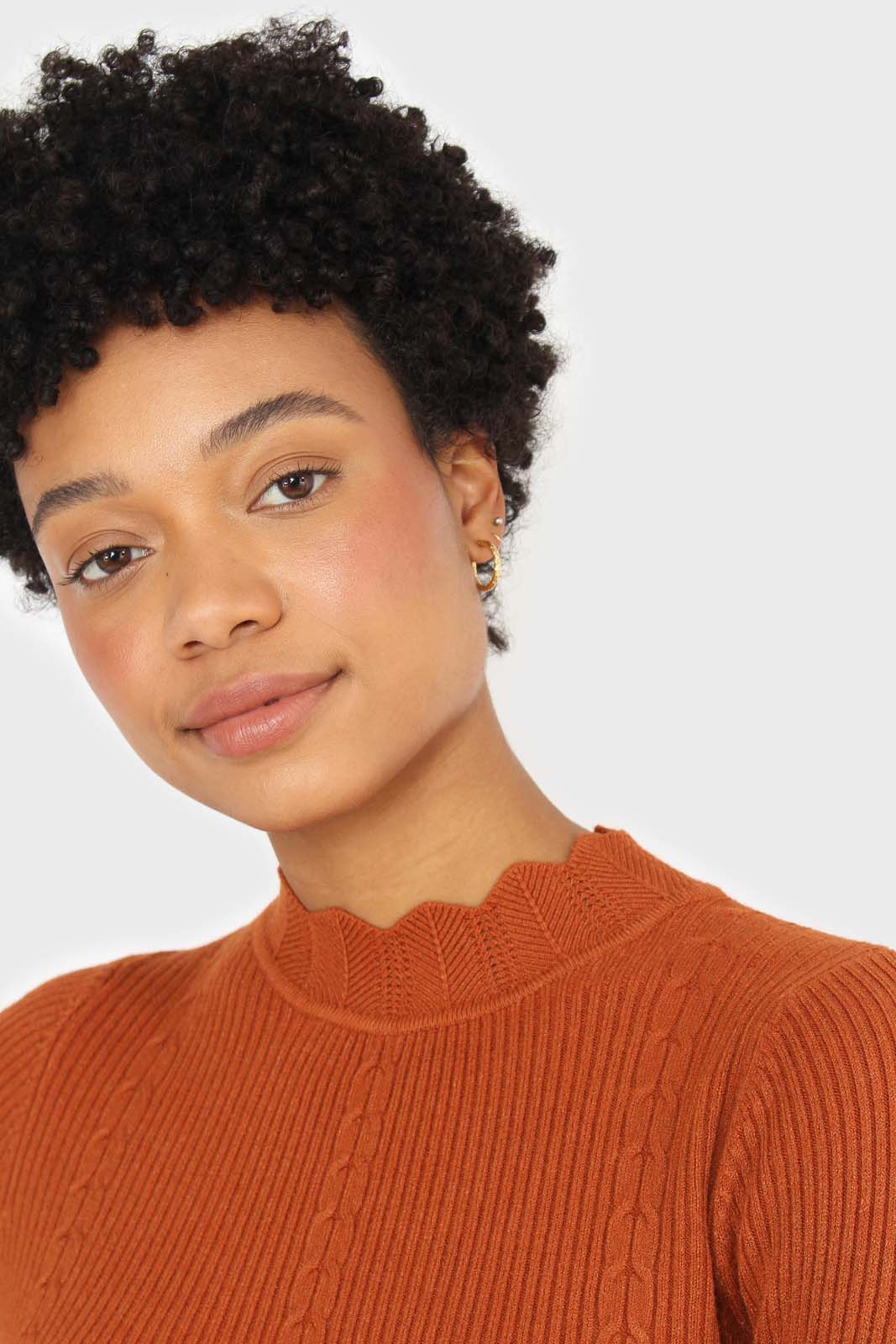 Burnt orange scalloped mock neck knit top