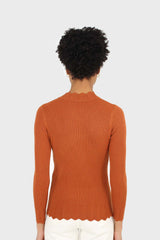 Burnt orange scalloped mock neck knit top