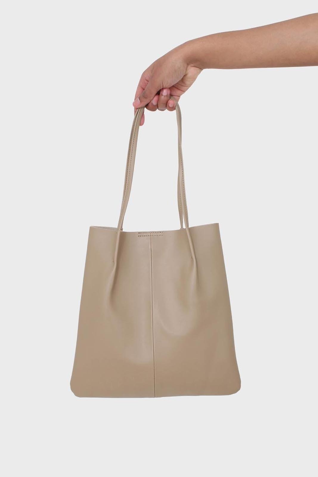 Light beige vegan leather pinched strap tote bag