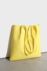 Bright yellow vegan leather pinched strap tote bag