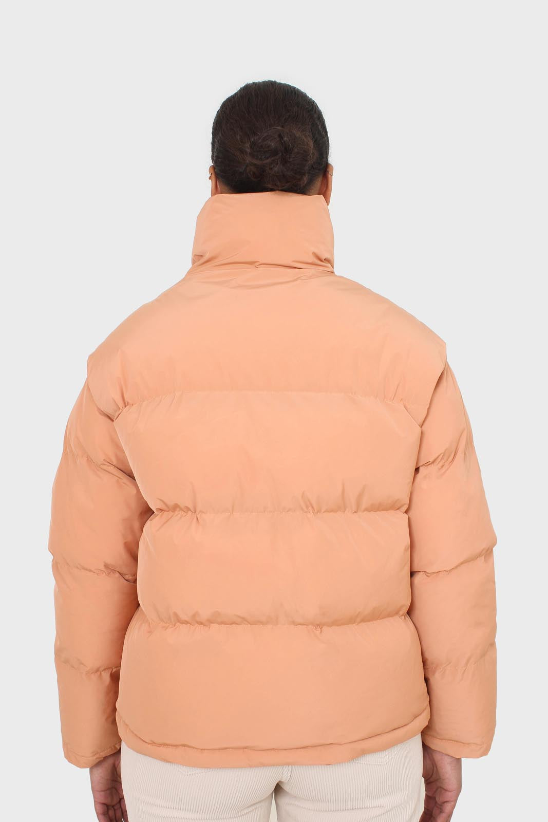 Pale orange puffer jacket