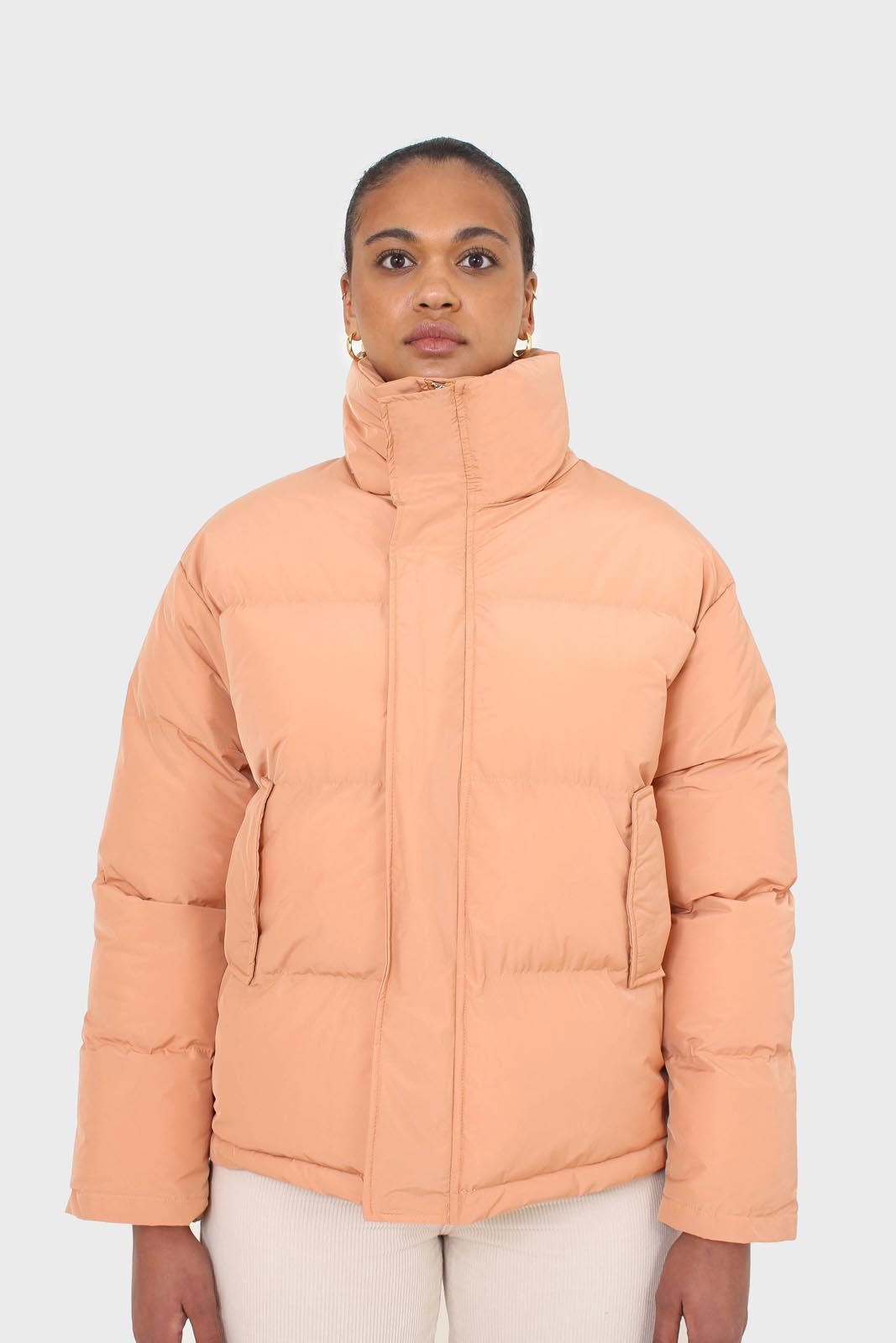 Pale orange puffer jacket