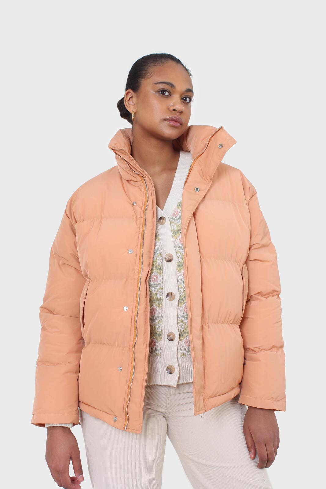 Pale orange puffer jacket