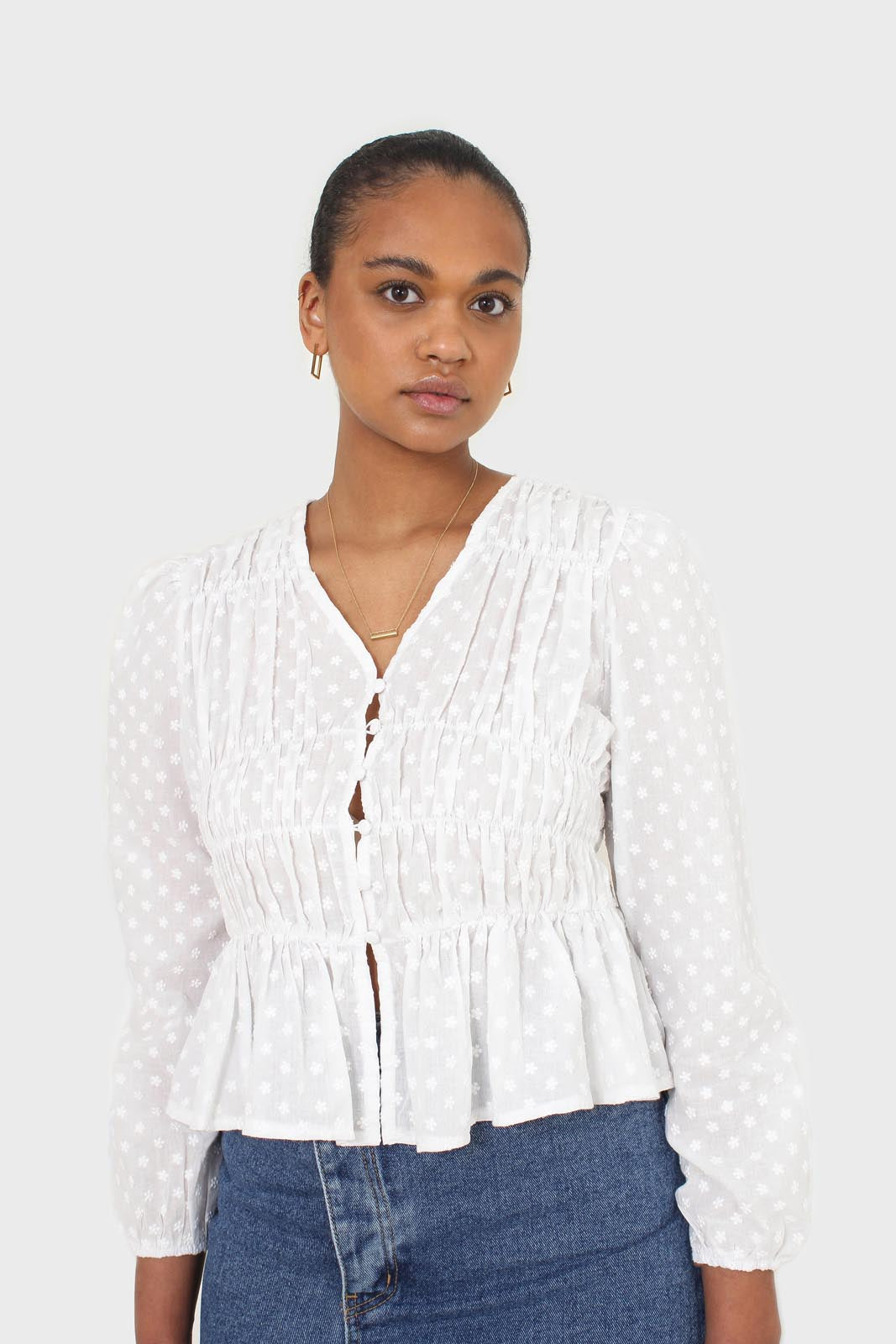 White embroidered floral blouse