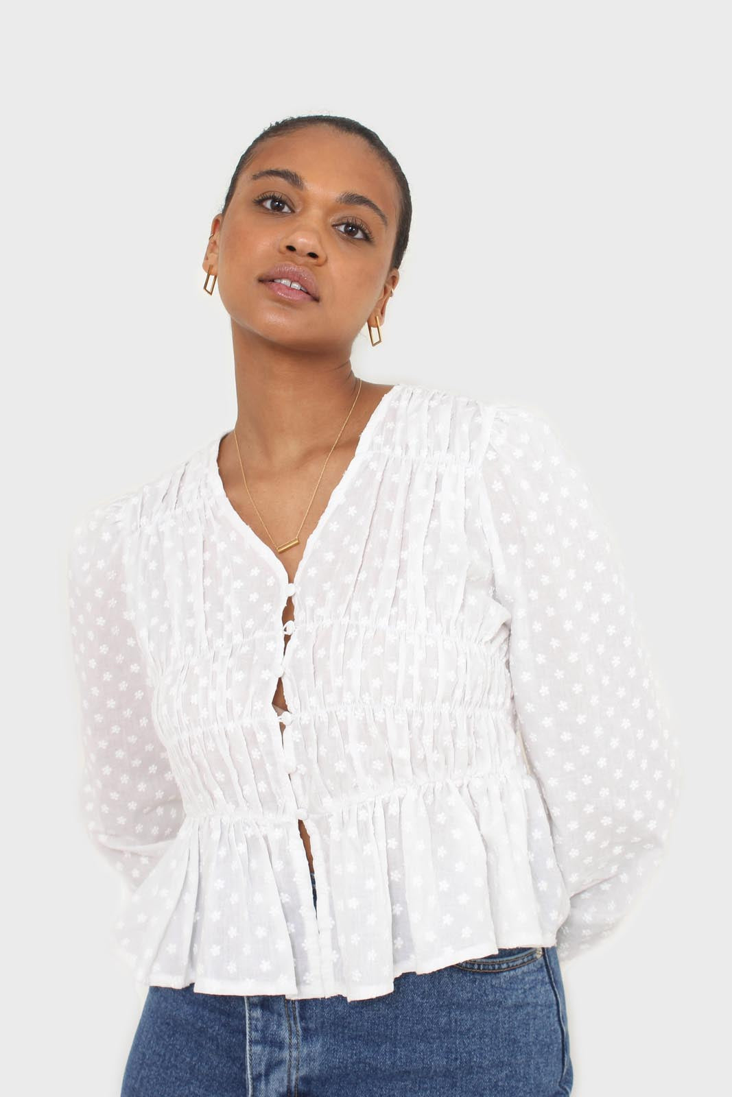 White embroidered floral blouse