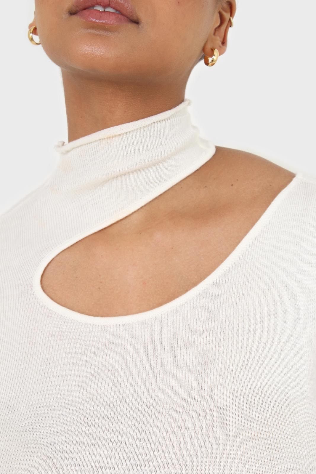 Ivory large cut out fitted knit turtleneck