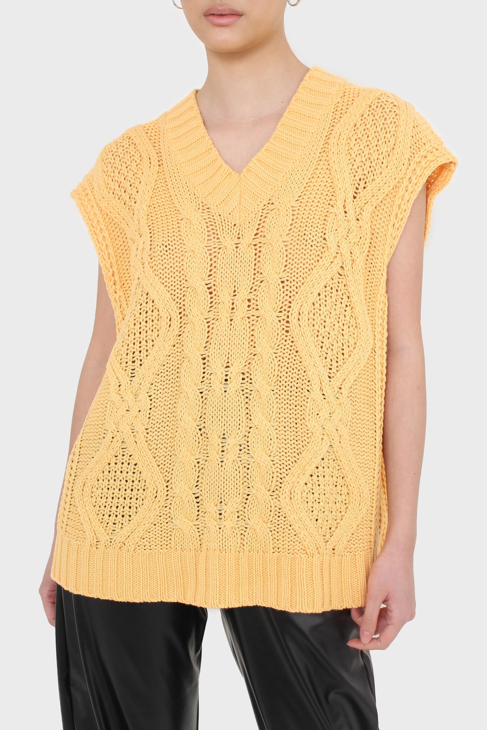 Bright orange cableknit sweater vest