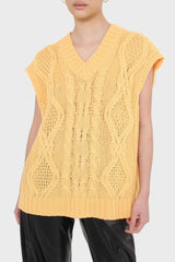 Bright orange cableknit sweater vest