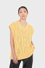 Bright orange cableknit sweater vest