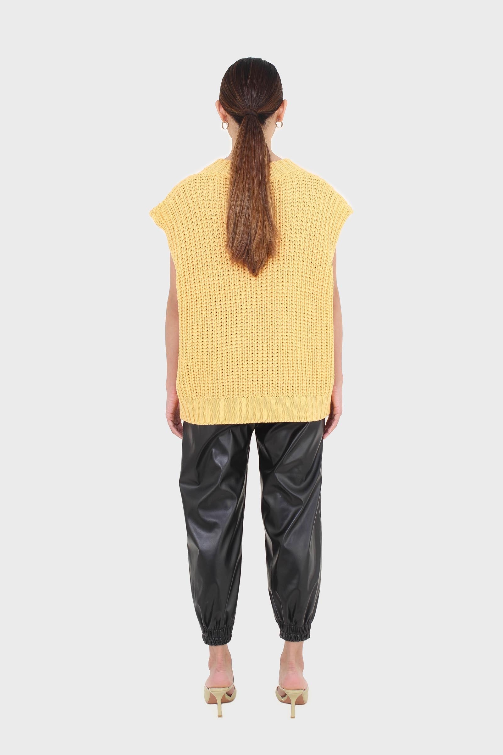 Bright orange cableknit sweater vest