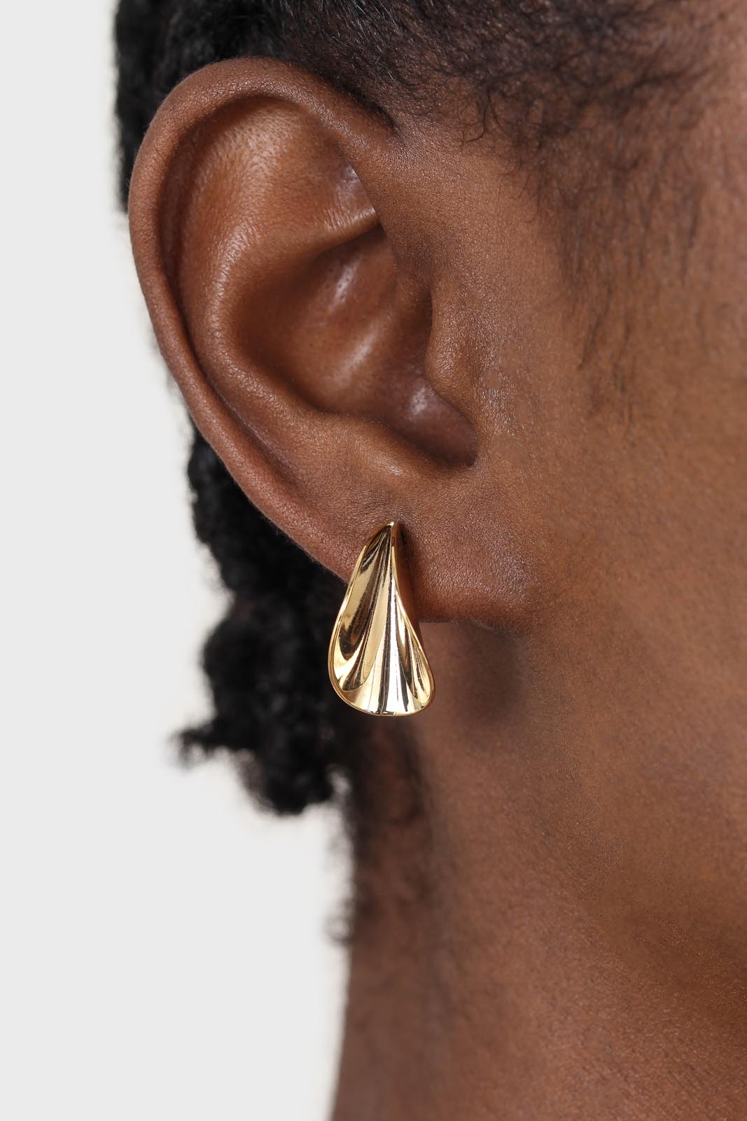 Gold pinched stud earrings