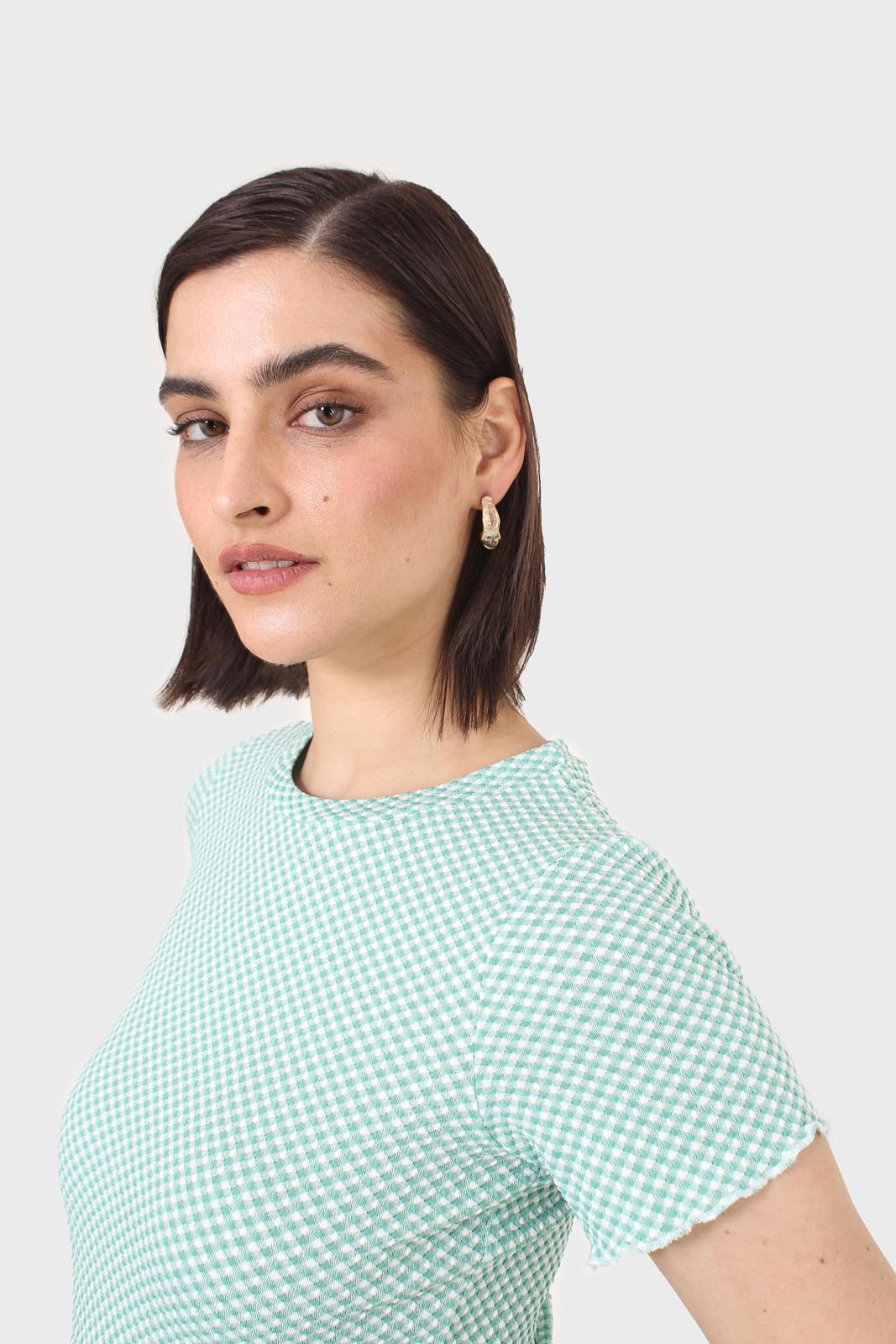 Green and ivory lettuce hem top