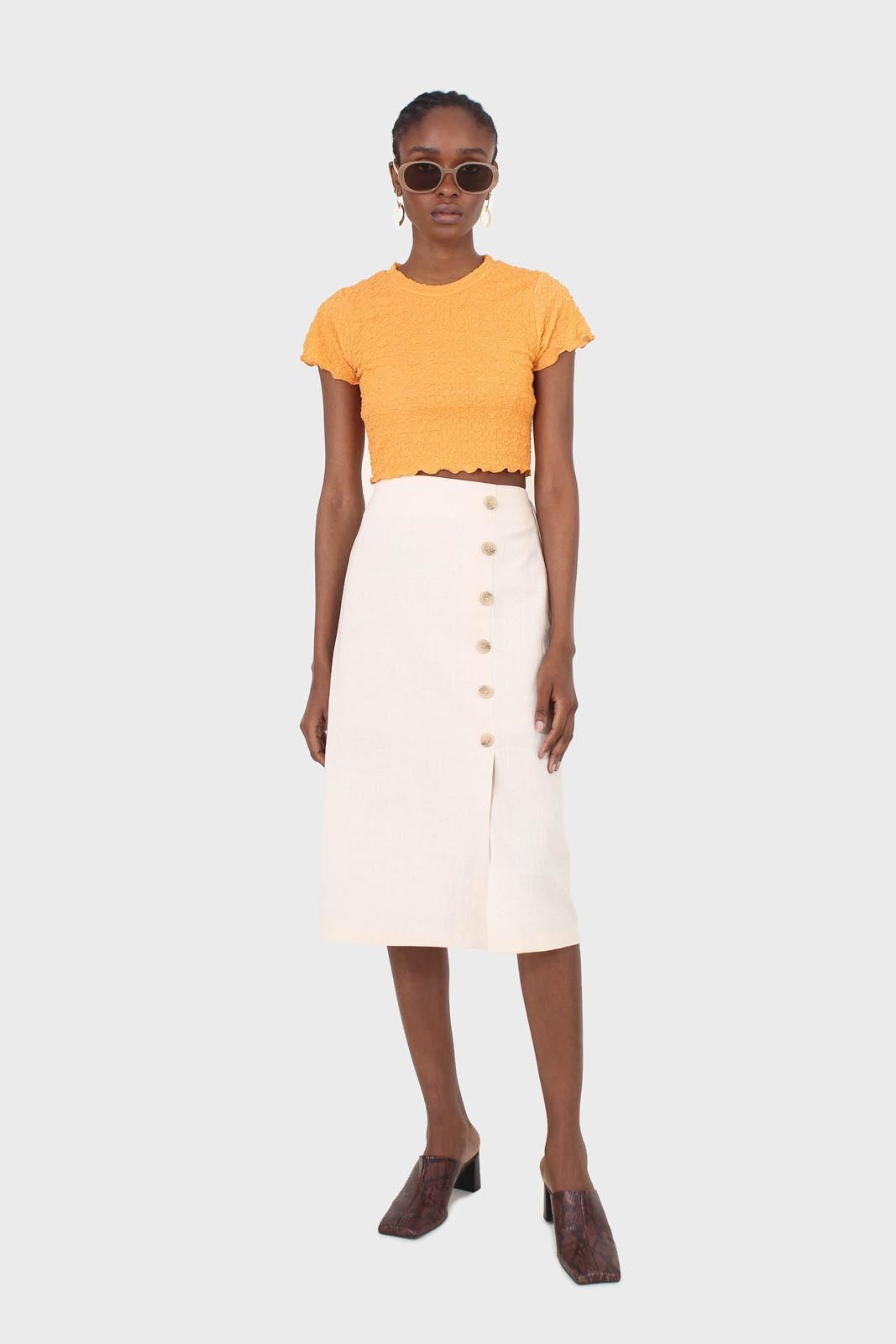 Ivory faux side button midi skirt