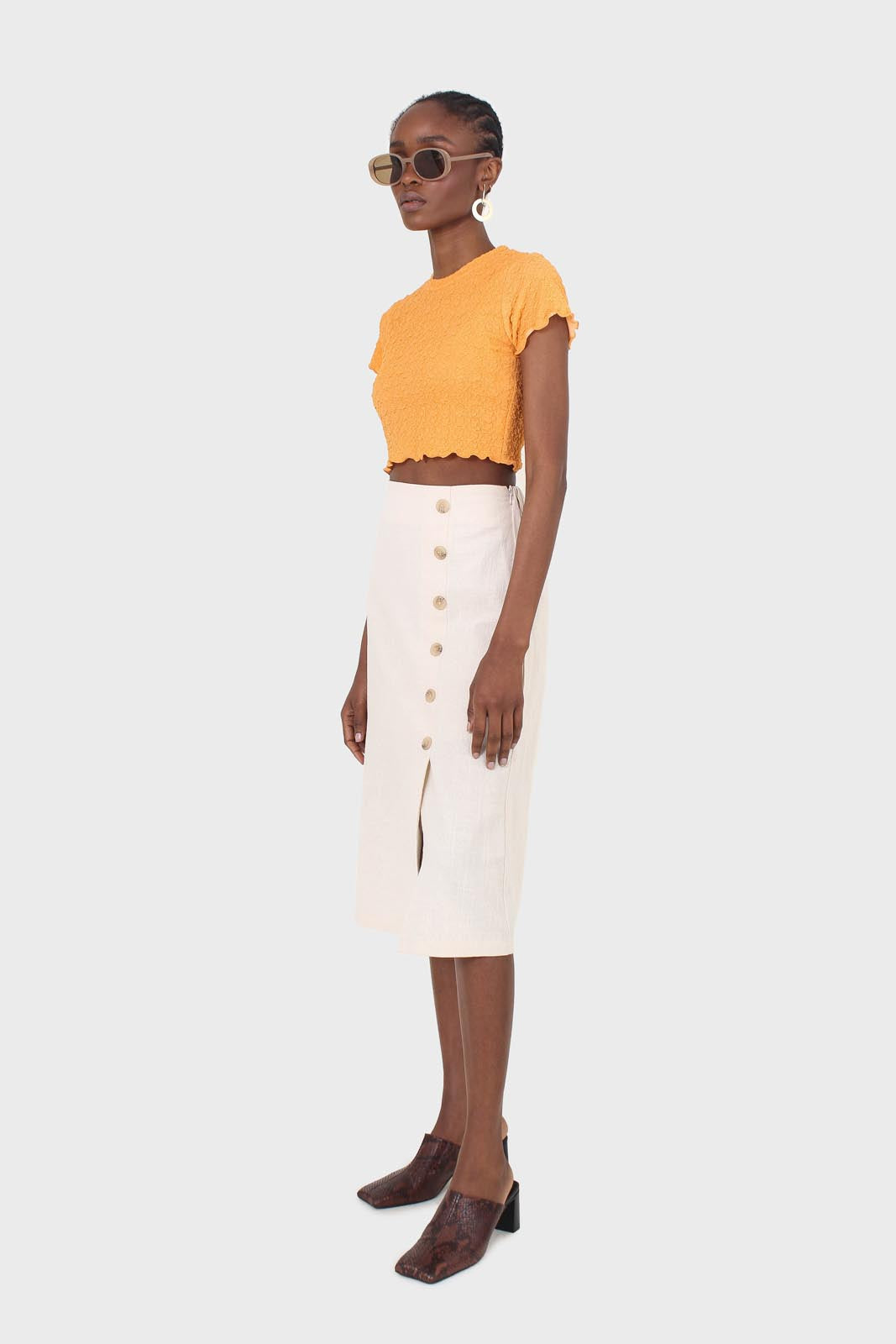Ivory faux side button midi skirt