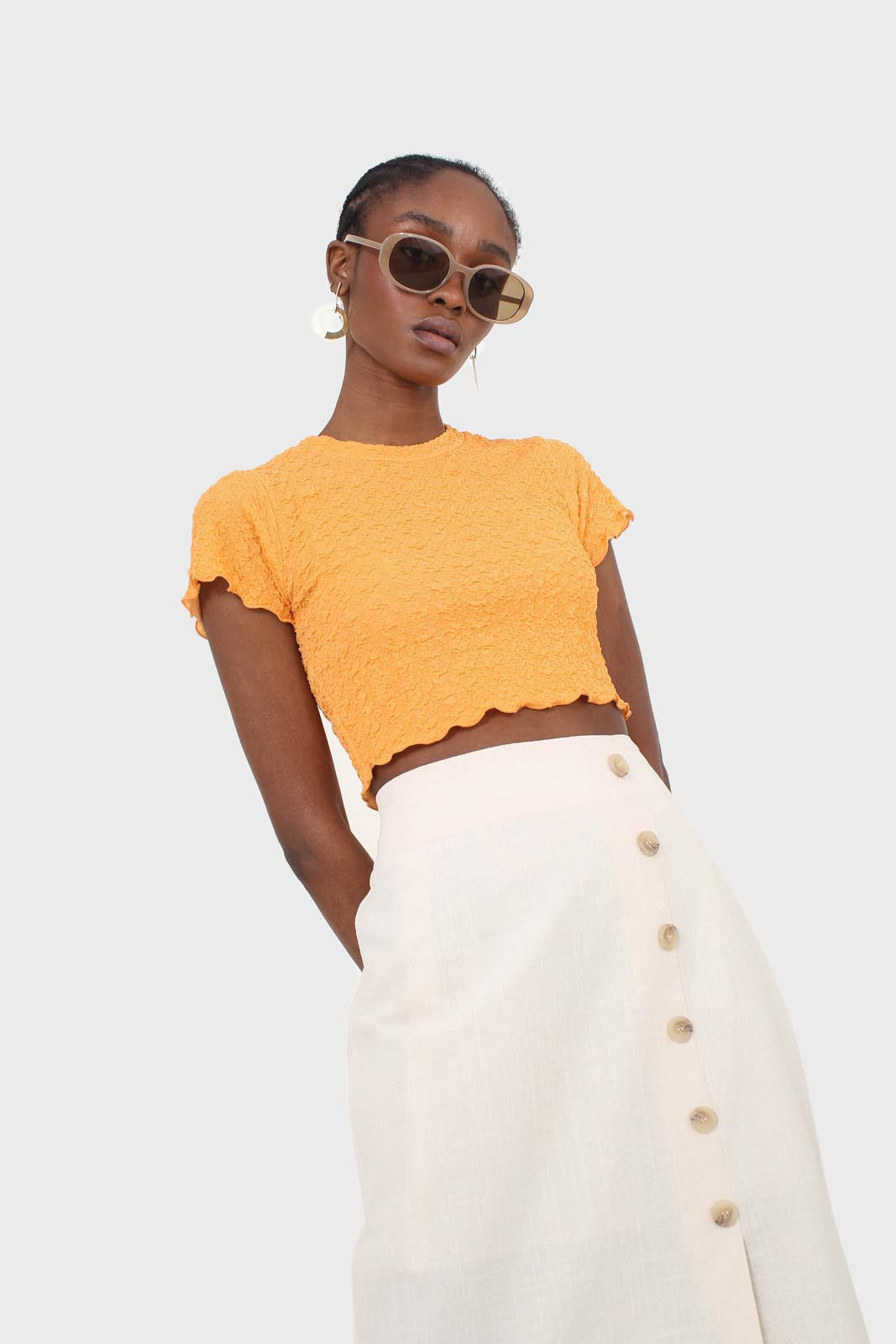 Ivory faux side button midi skirt