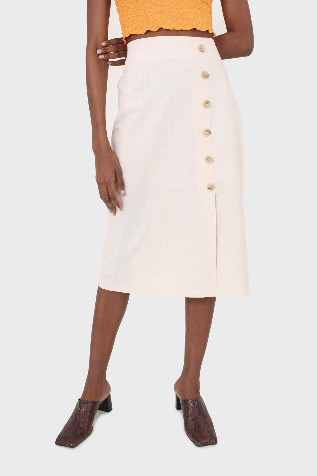 Ivory faux side button midi skirt