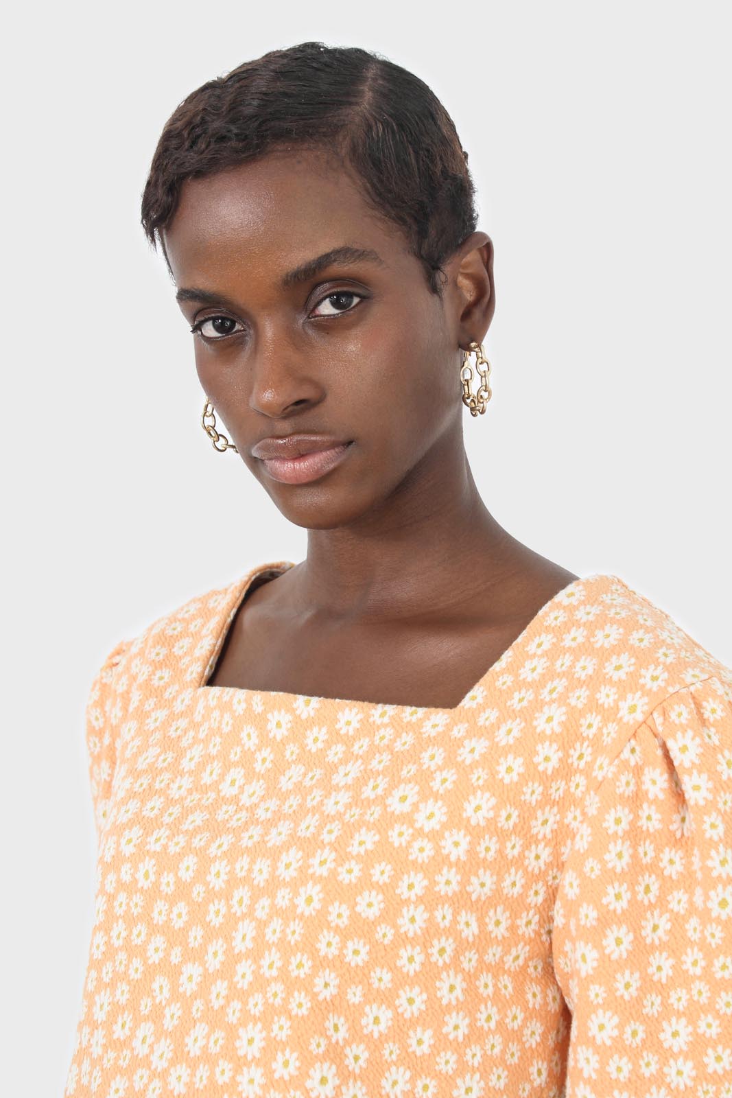 Orange daisies square neckline puff sleeve cropped top