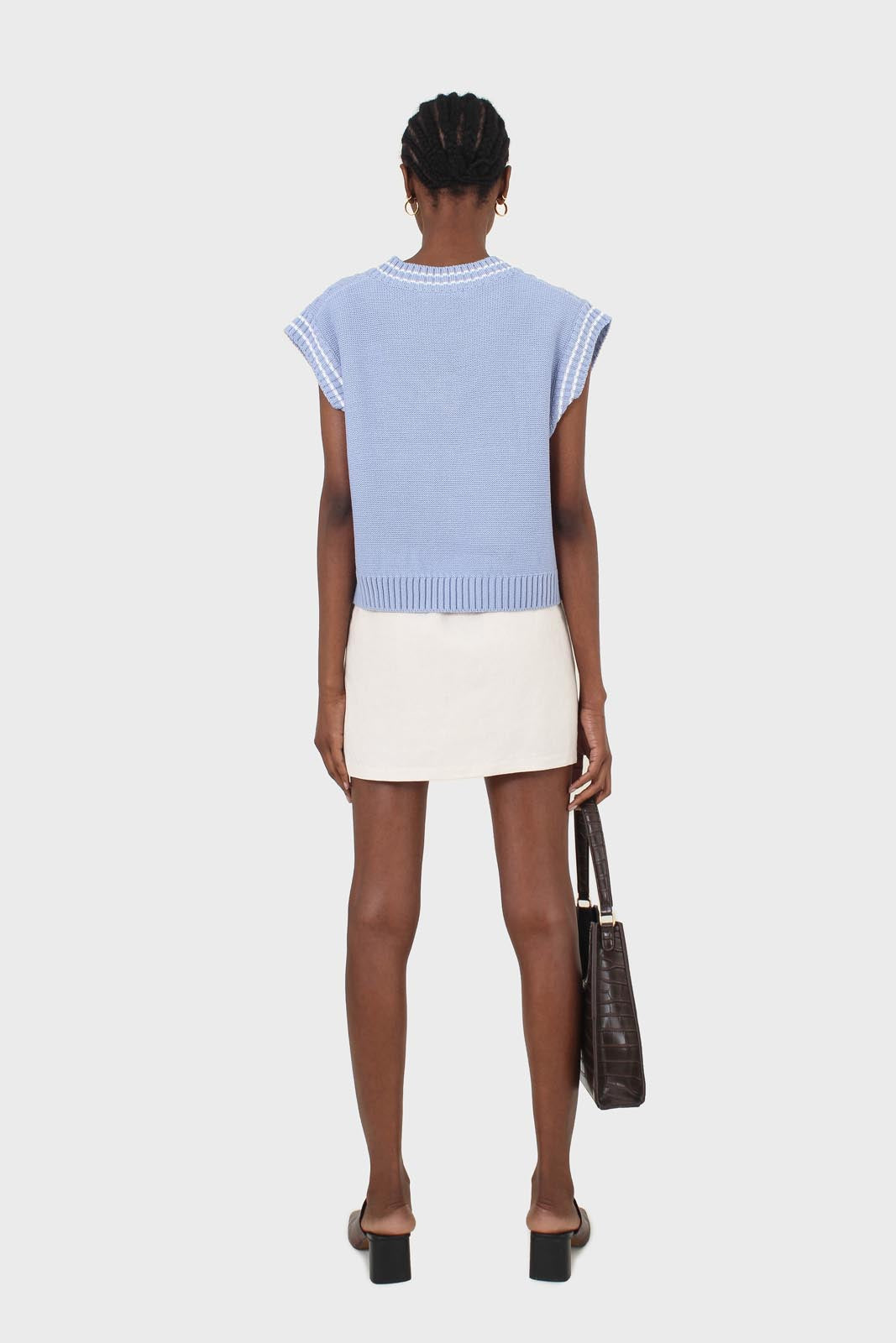 Light blue and white varsity cable sweater vest