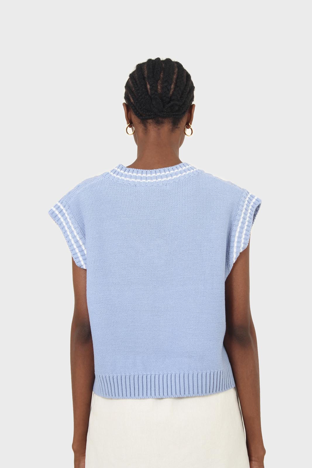 Light blue and white varsity cable sweater vest