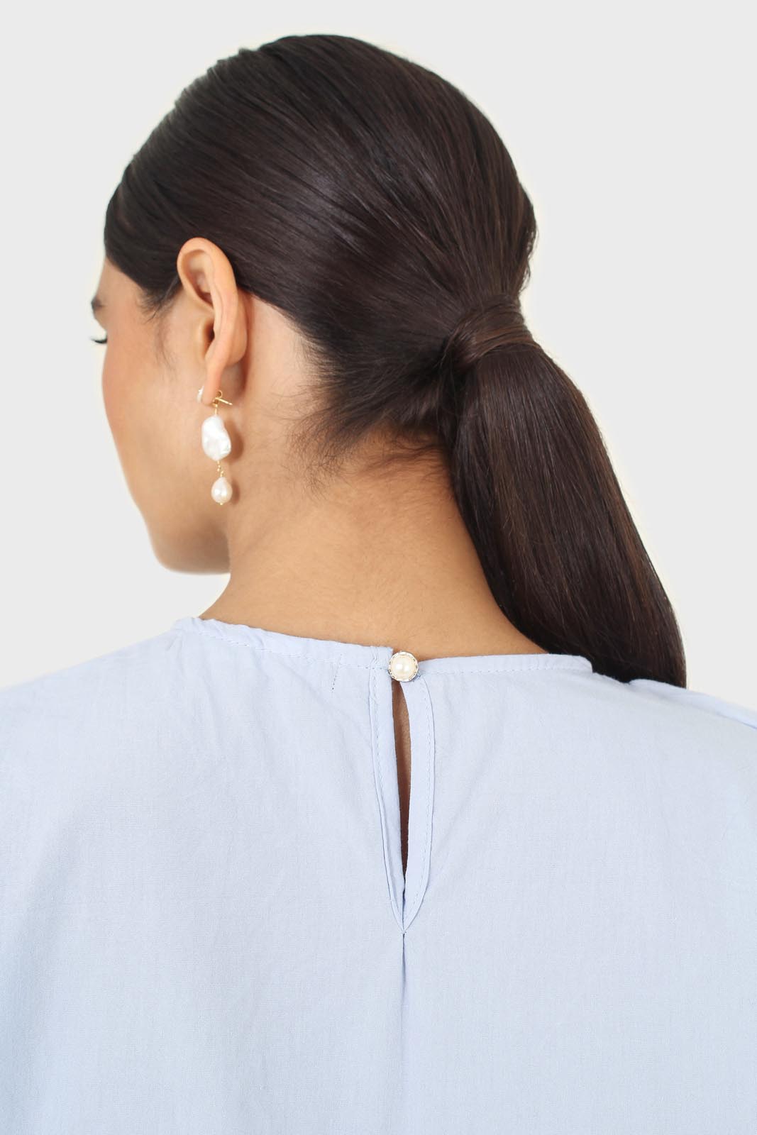 Sky blue asymmetric frill short sleeved top