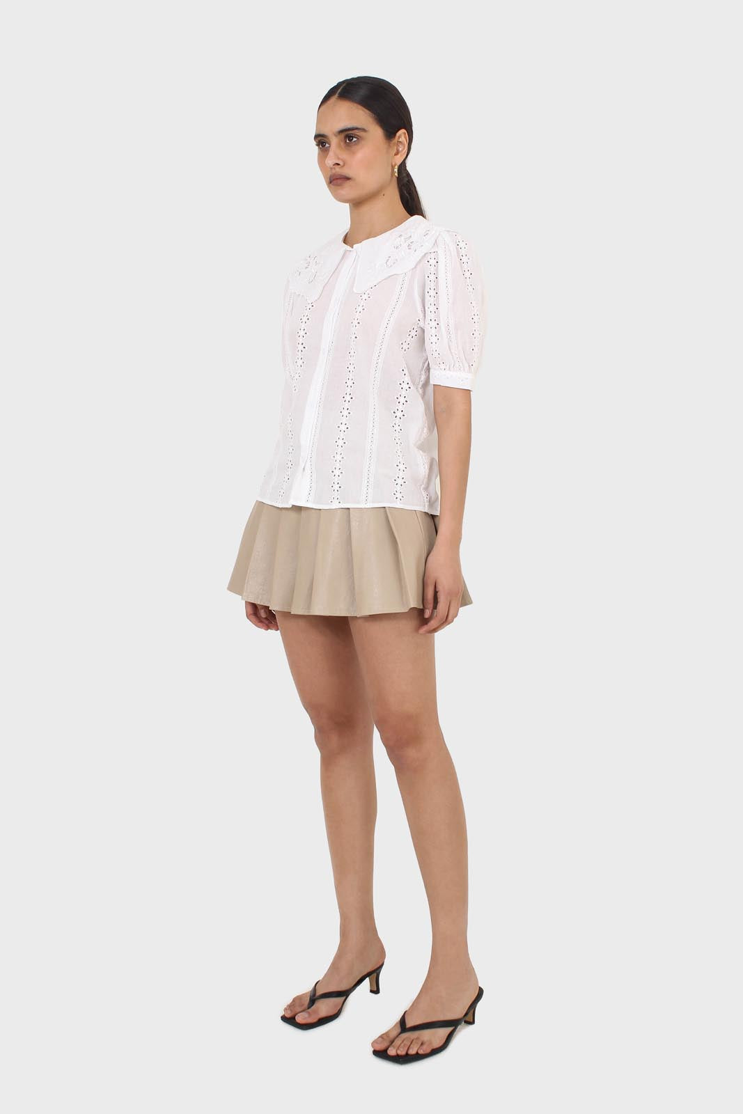 Beige waxed pleated mini skirt