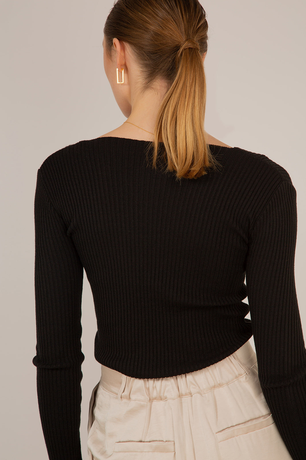 Black V-neck ribbed long sleeved knit top