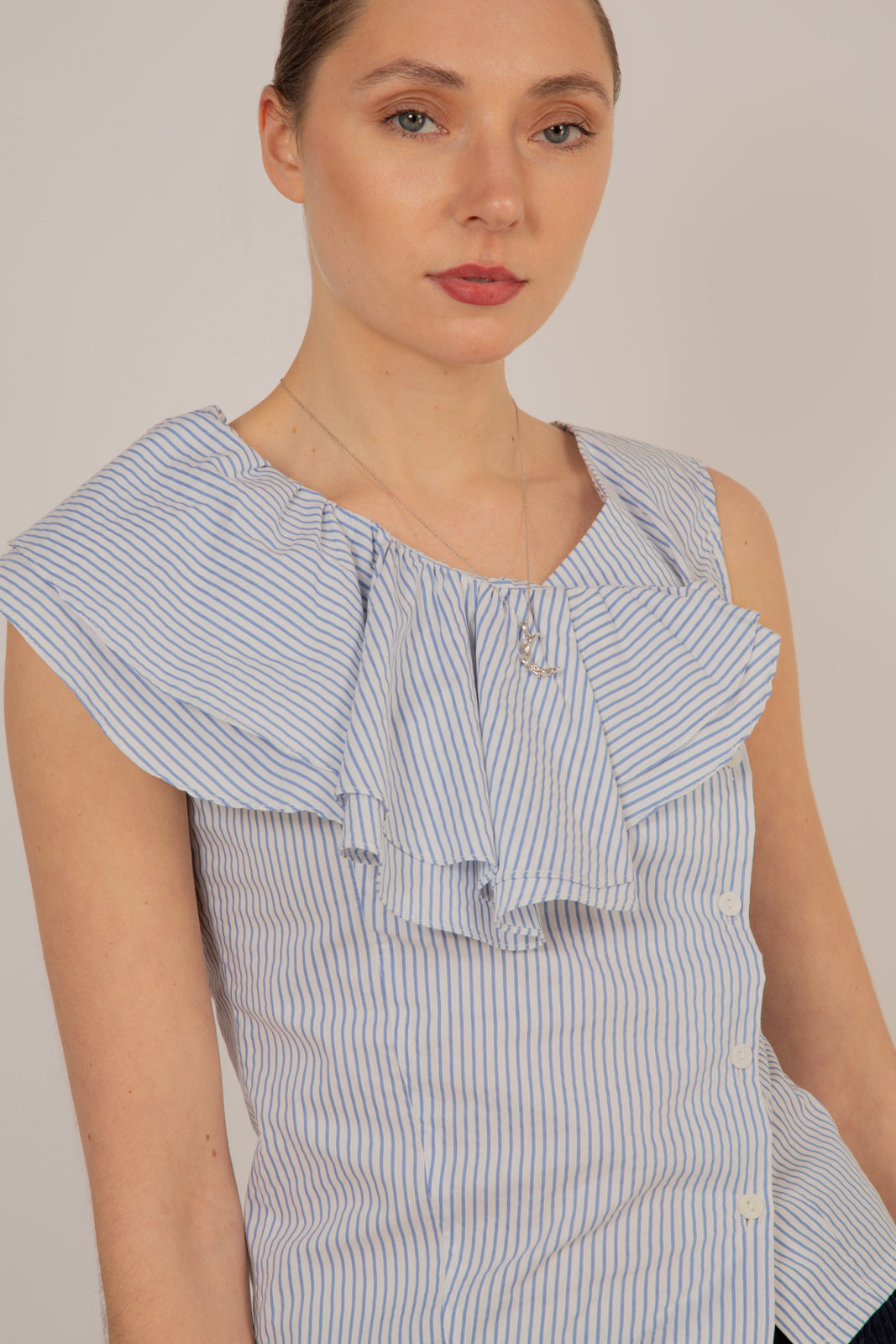 Blue and white striped asymmetric ruffle top