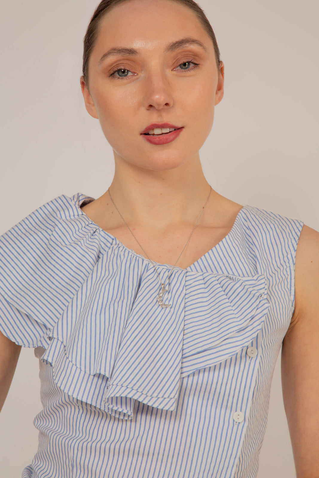 Blue and white striped asymmetric ruffle top