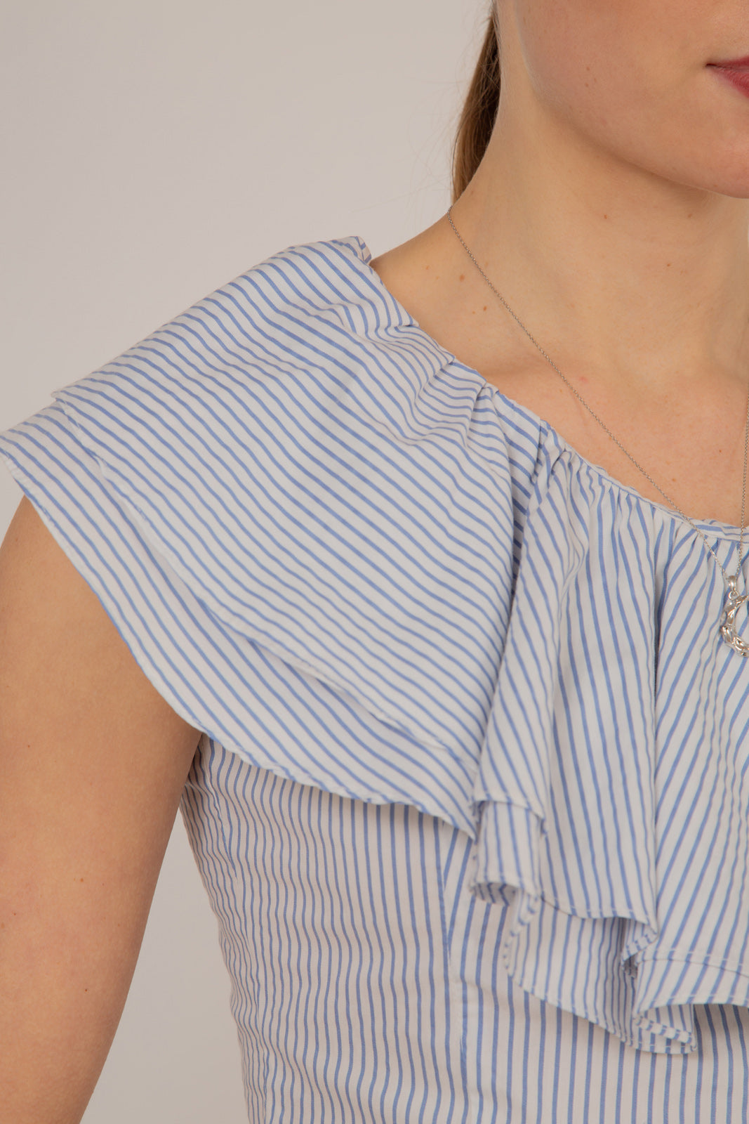 Blue and white striped asymmetric ruffle top