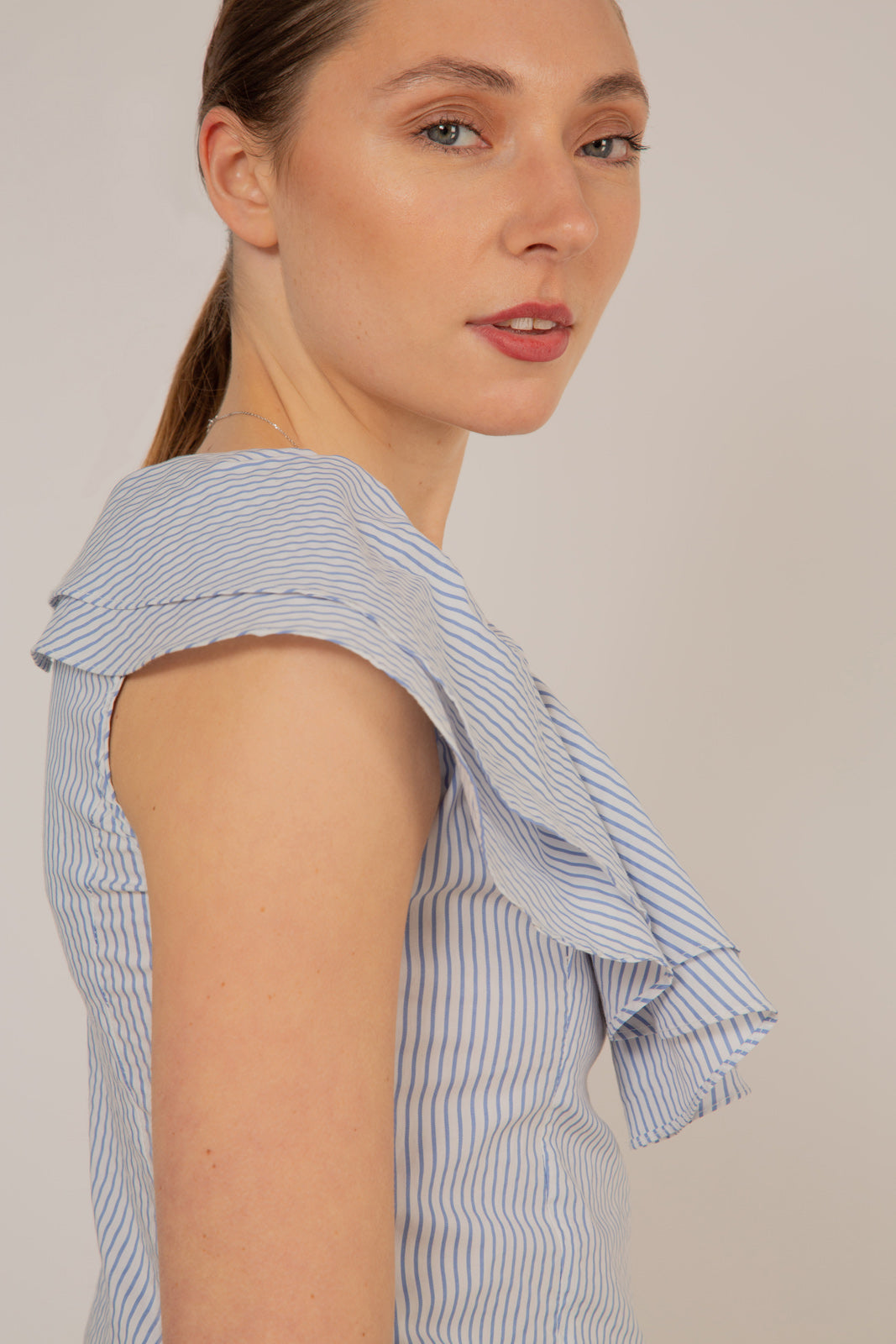 Blue and white striped asymmetric ruffle top
