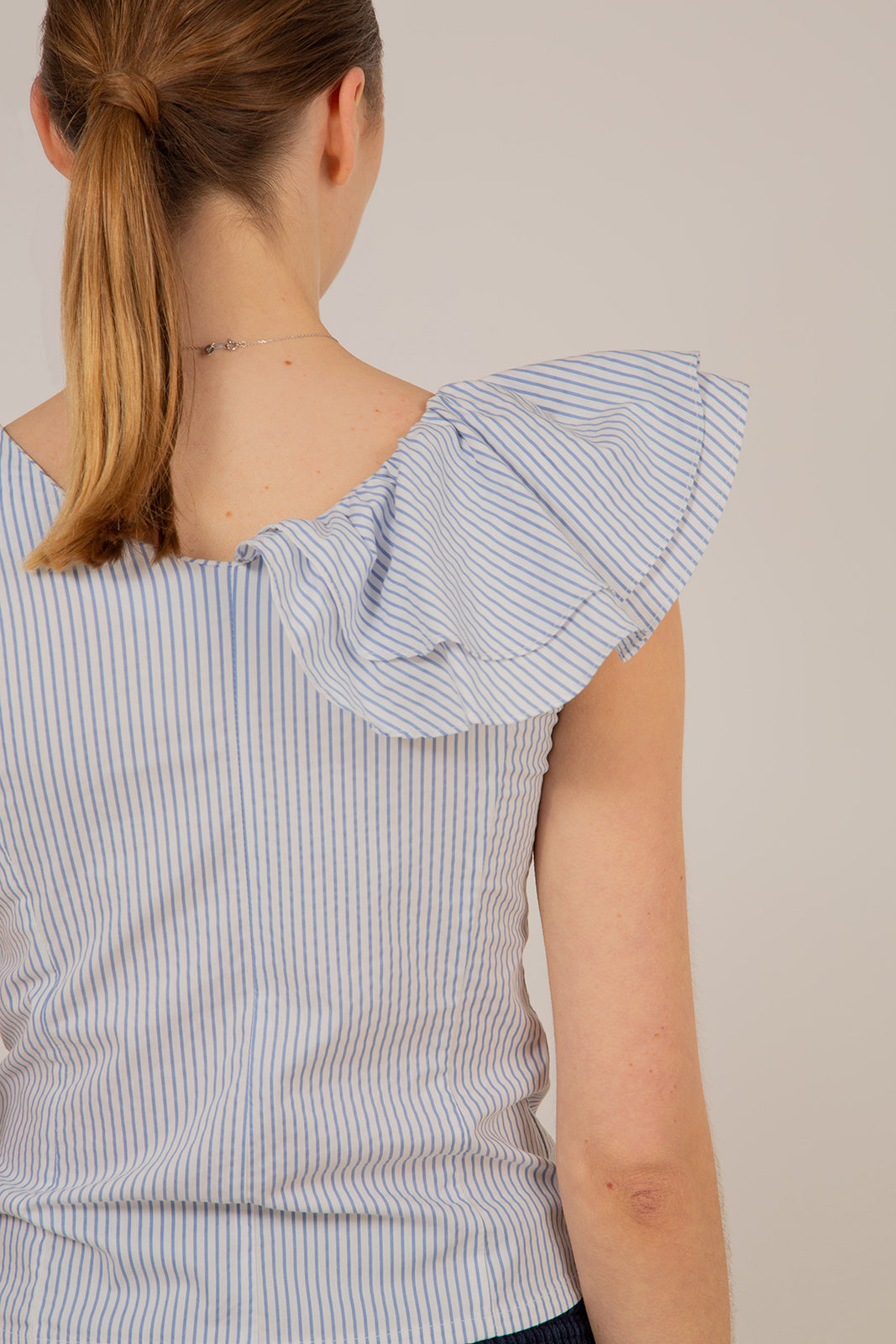 Blue and white striped asymmetric ruffle top