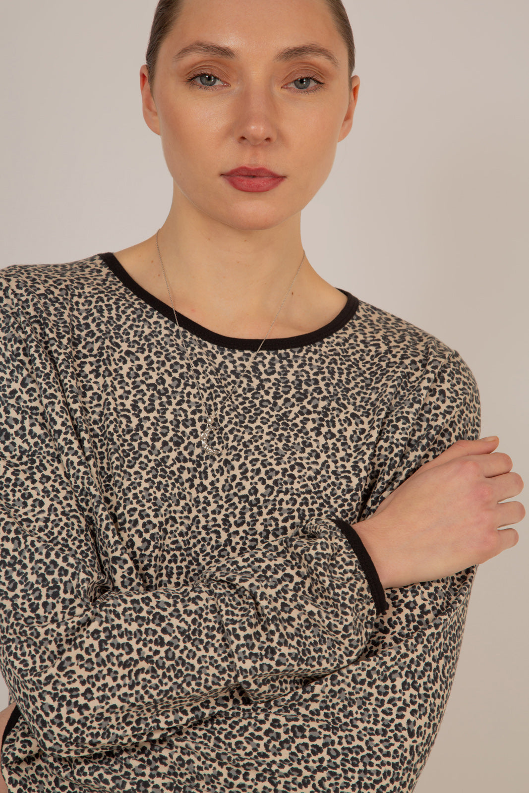 Ivory and black leopard print cropped long sleeved top