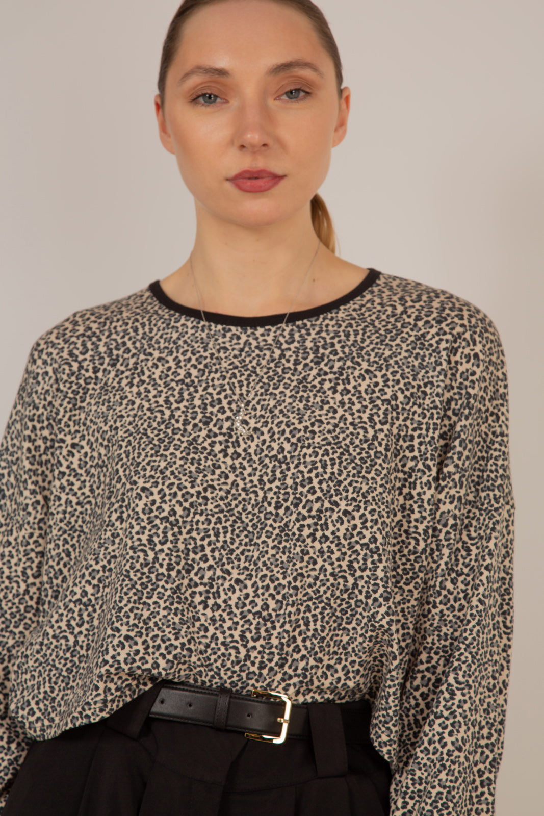 Ivory and black leopard print cropped long sleeved top