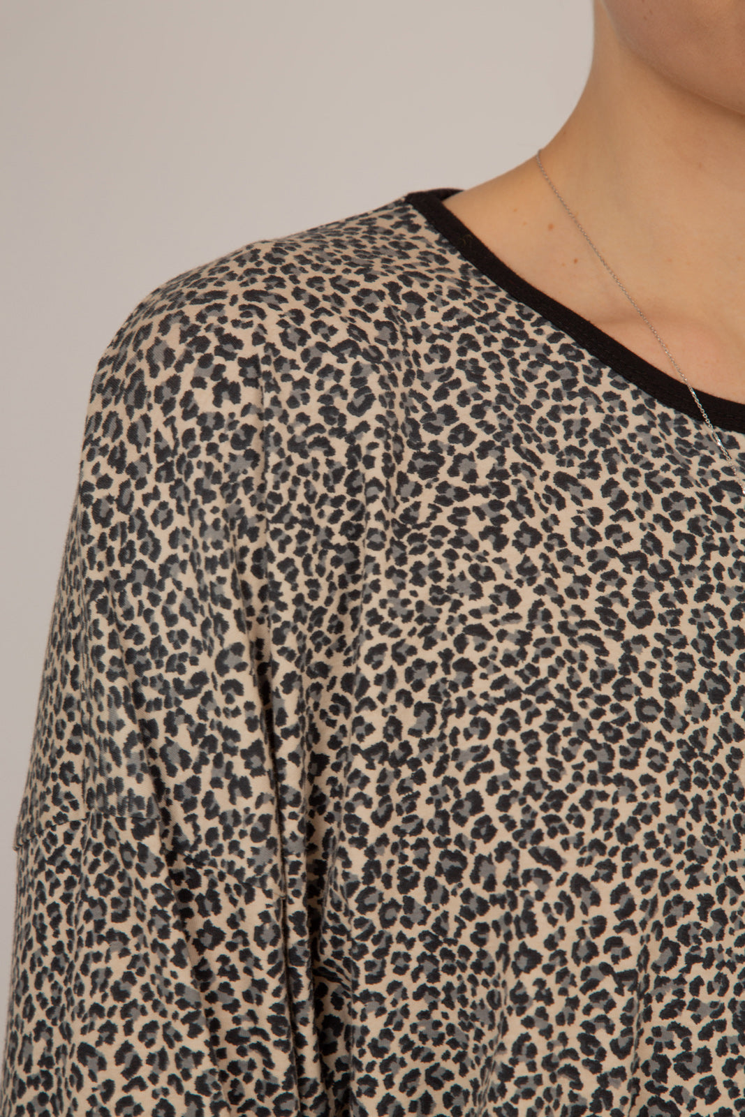 Ivory and black leopard print cropped long sleeved top