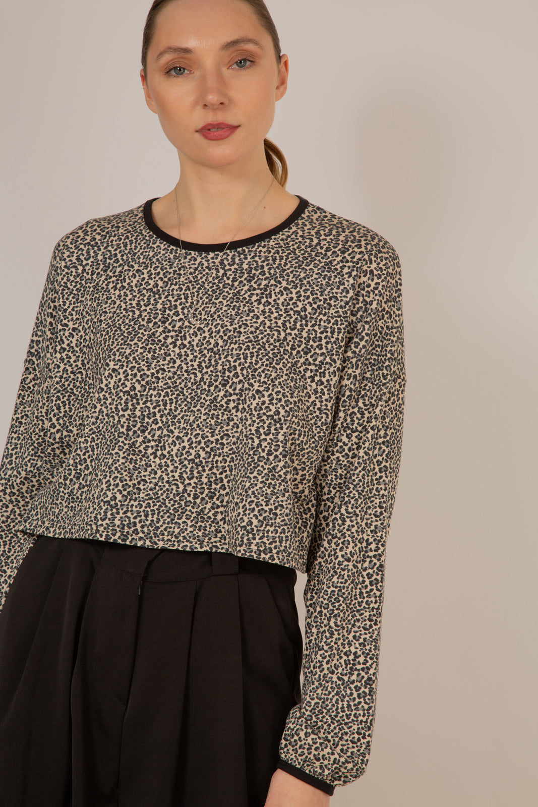 Ivory and black leopard print cropped long sleeved top