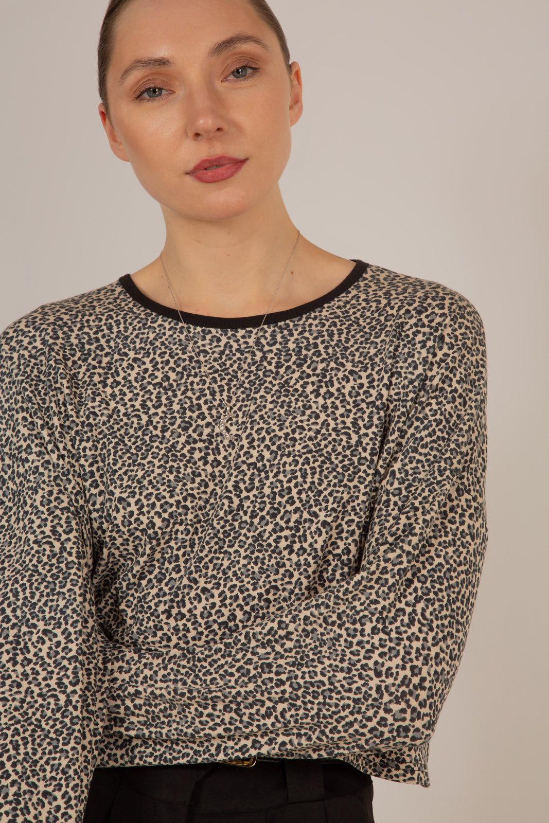 Ivory and black leopard print cropped long sleeved top
