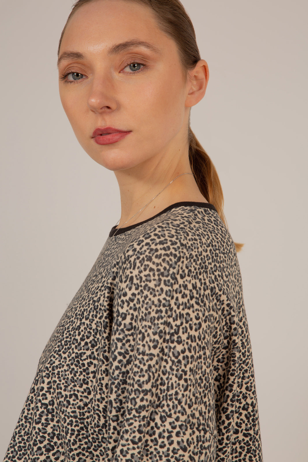 Ivory and black leopard print cropped long sleeved top