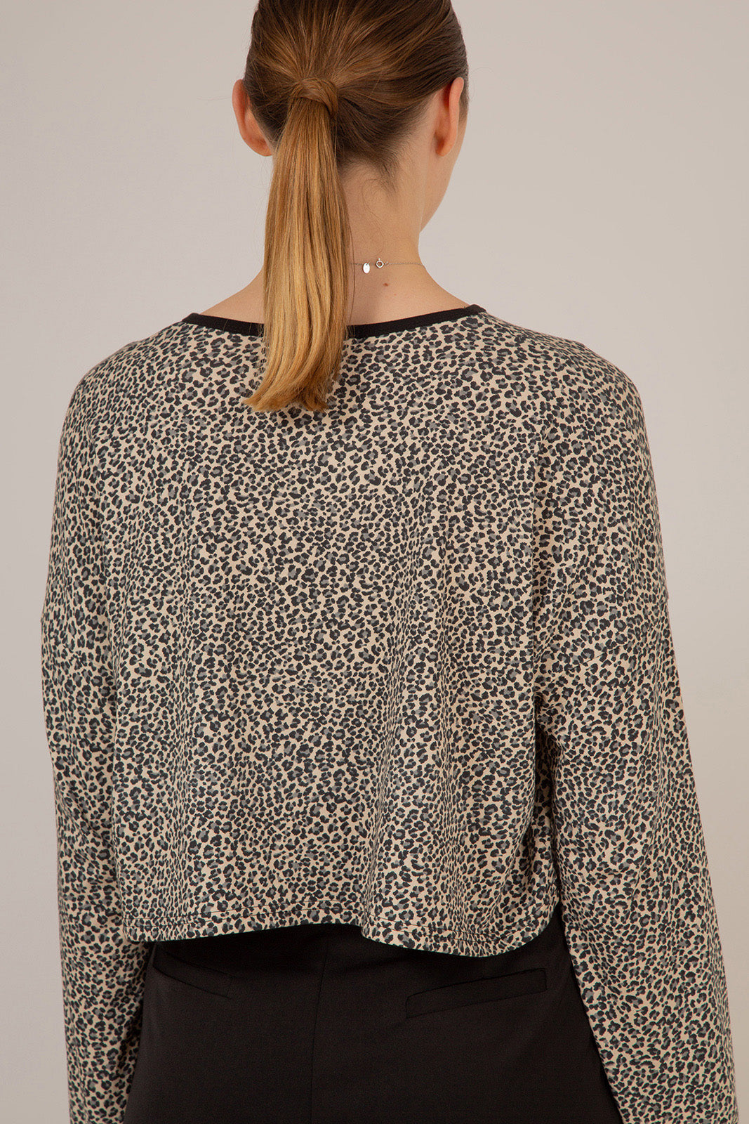 Ivory and black leopard print cropped long sleeved top