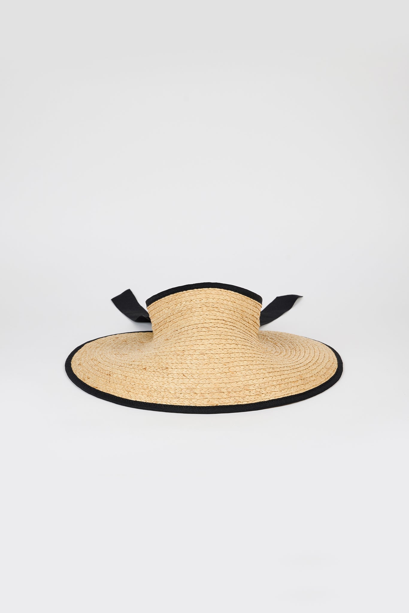 Beige raffia and black trimmed ribbon tie bonnet