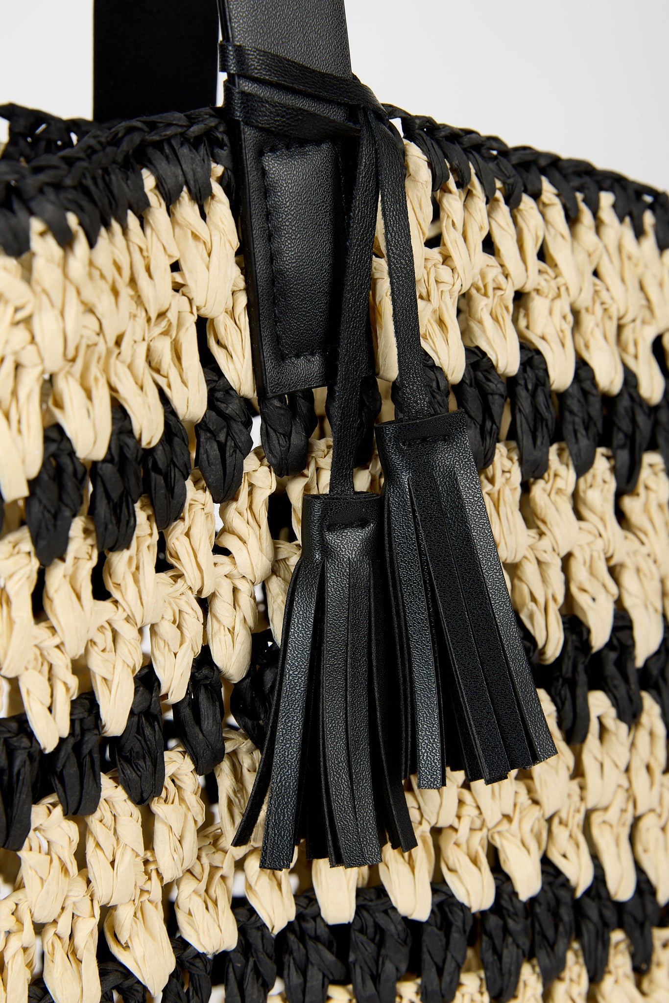 Black and beige striped straw tote bag