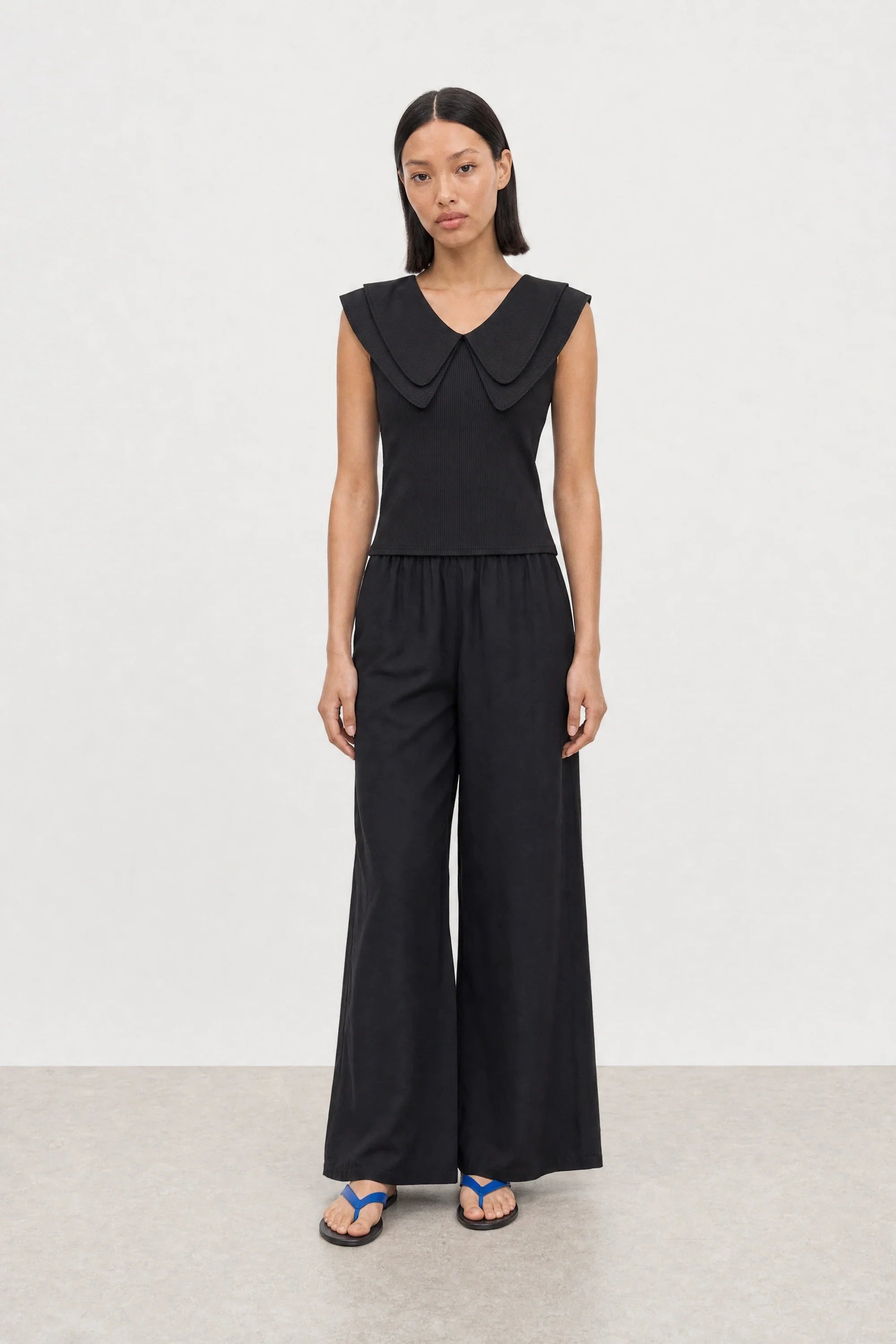 Black giant pointed double collar sleeveless top