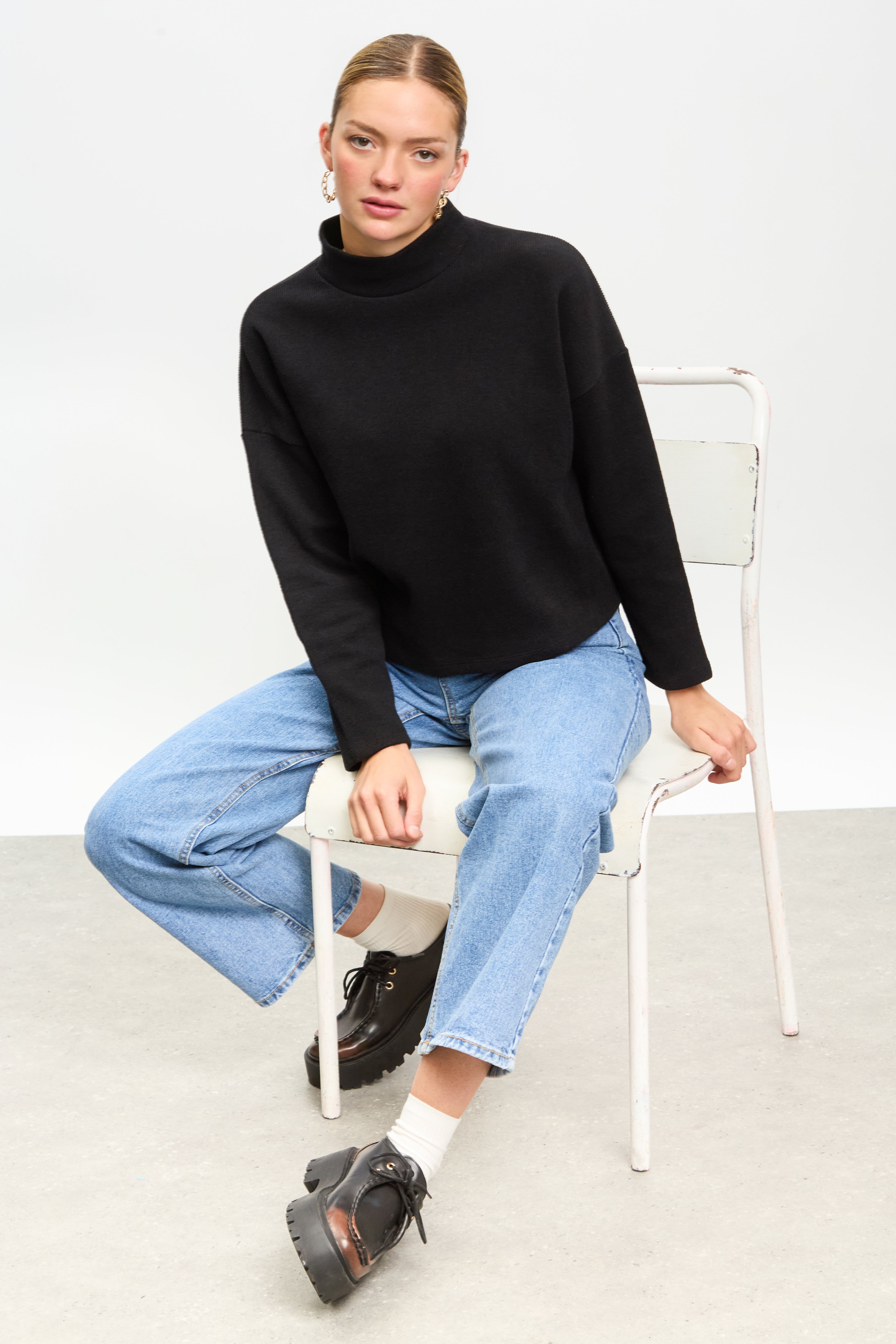 Black micro ribbed mock neck top