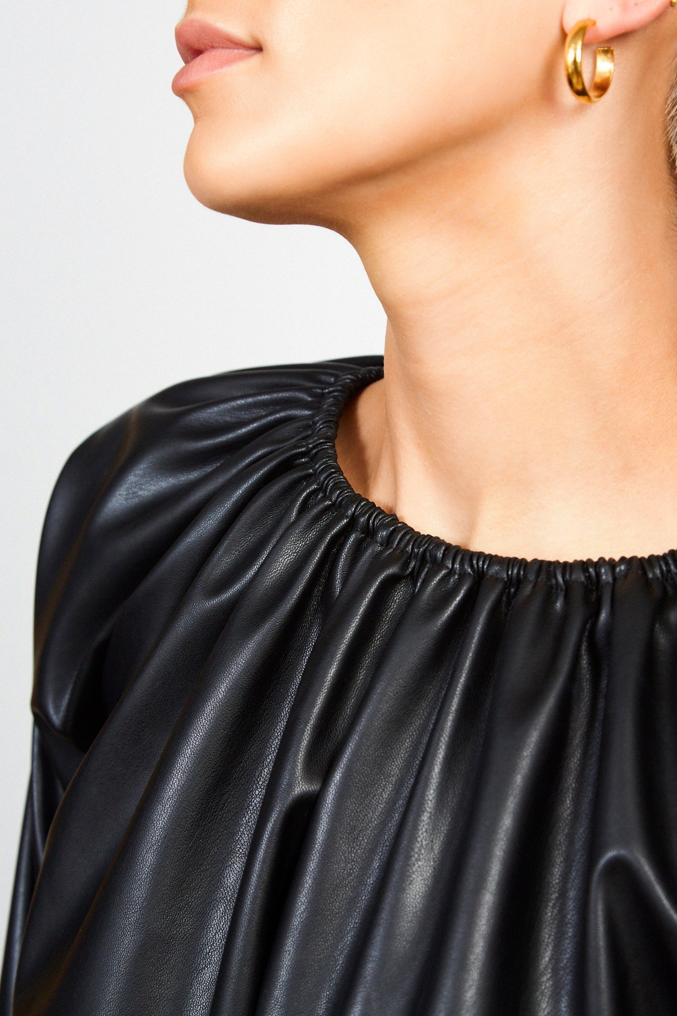 Black ruched neck long sleeved vegan leather top