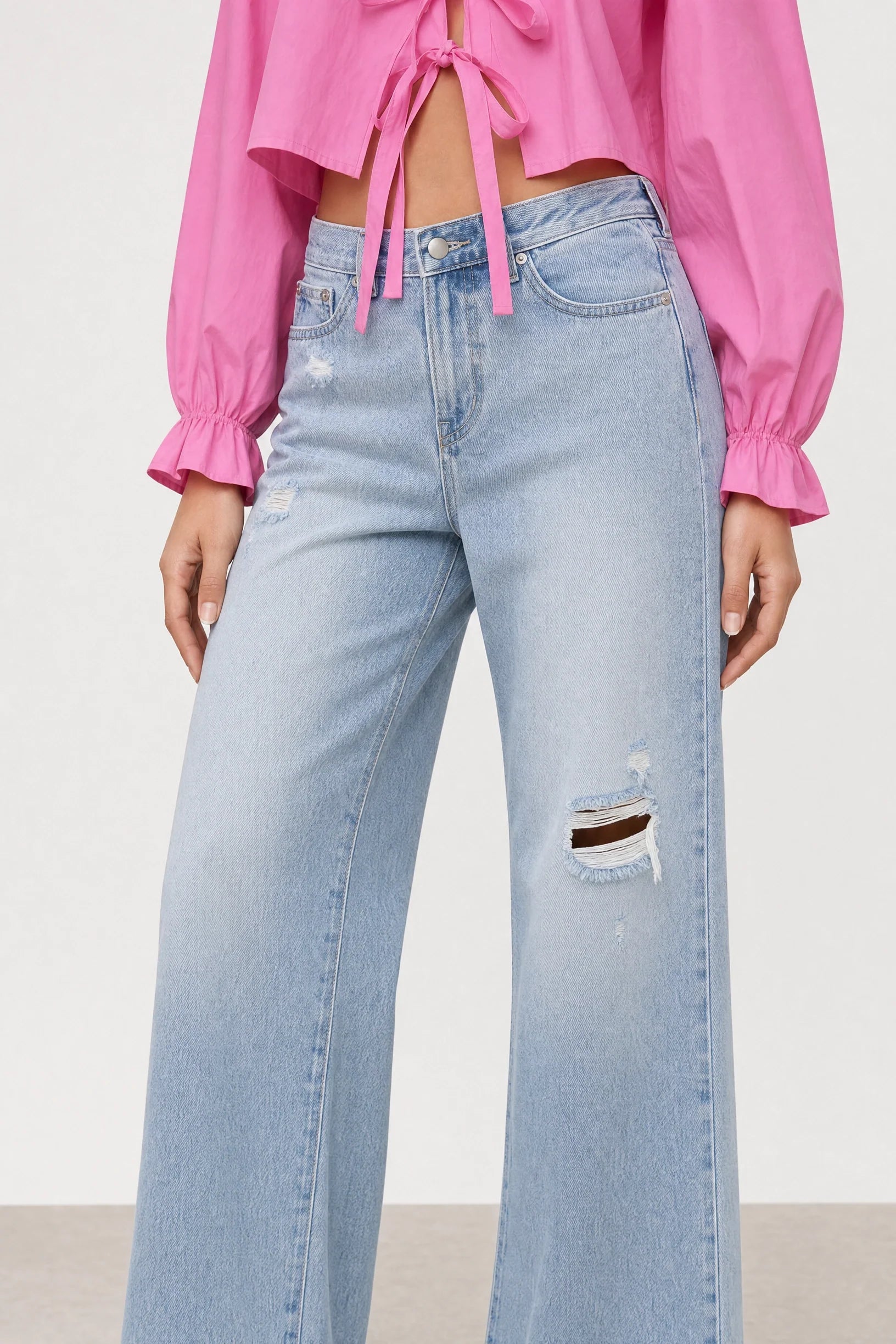 Blue light wash distressed detail jeans