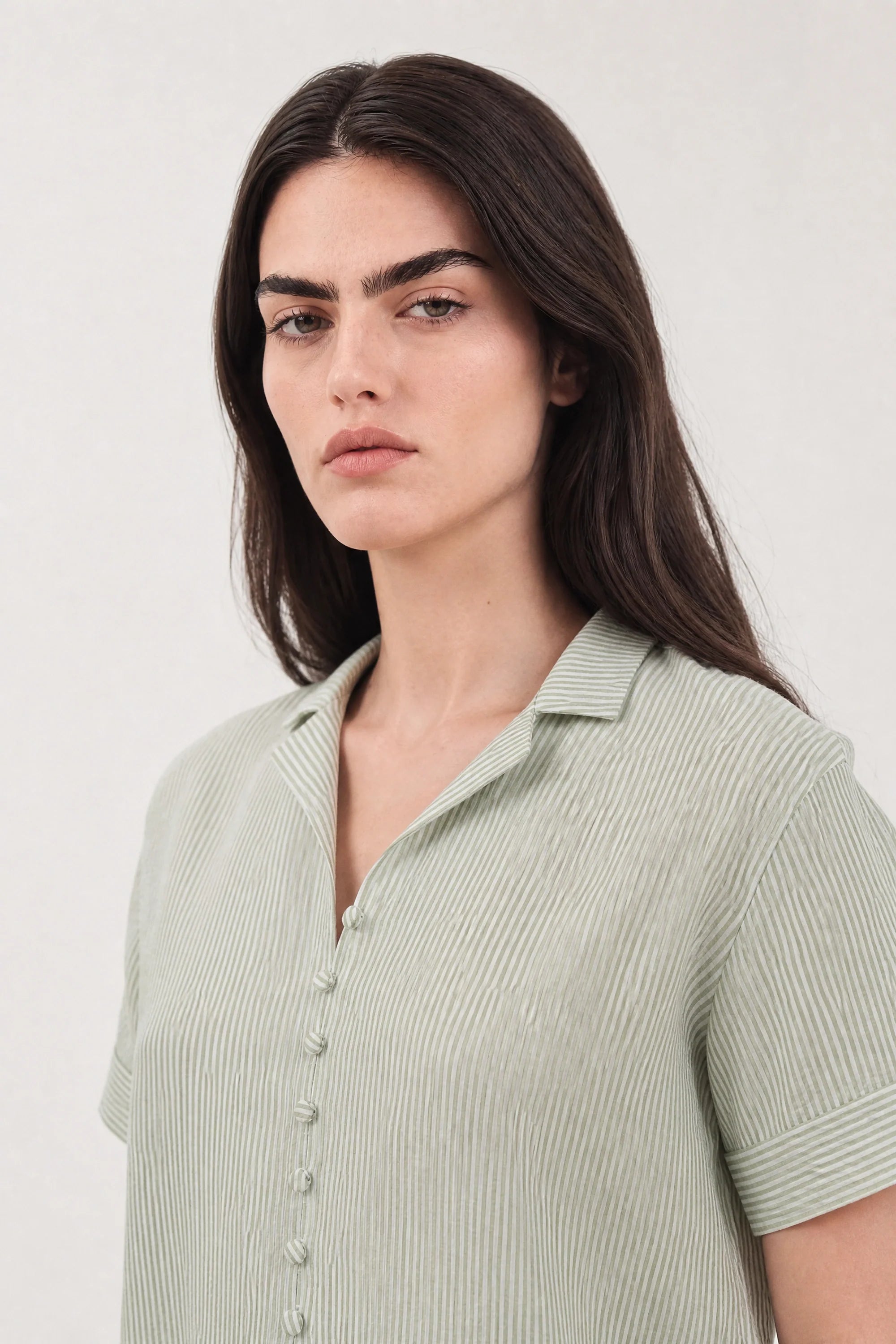 Green and white seersucker striped shirt