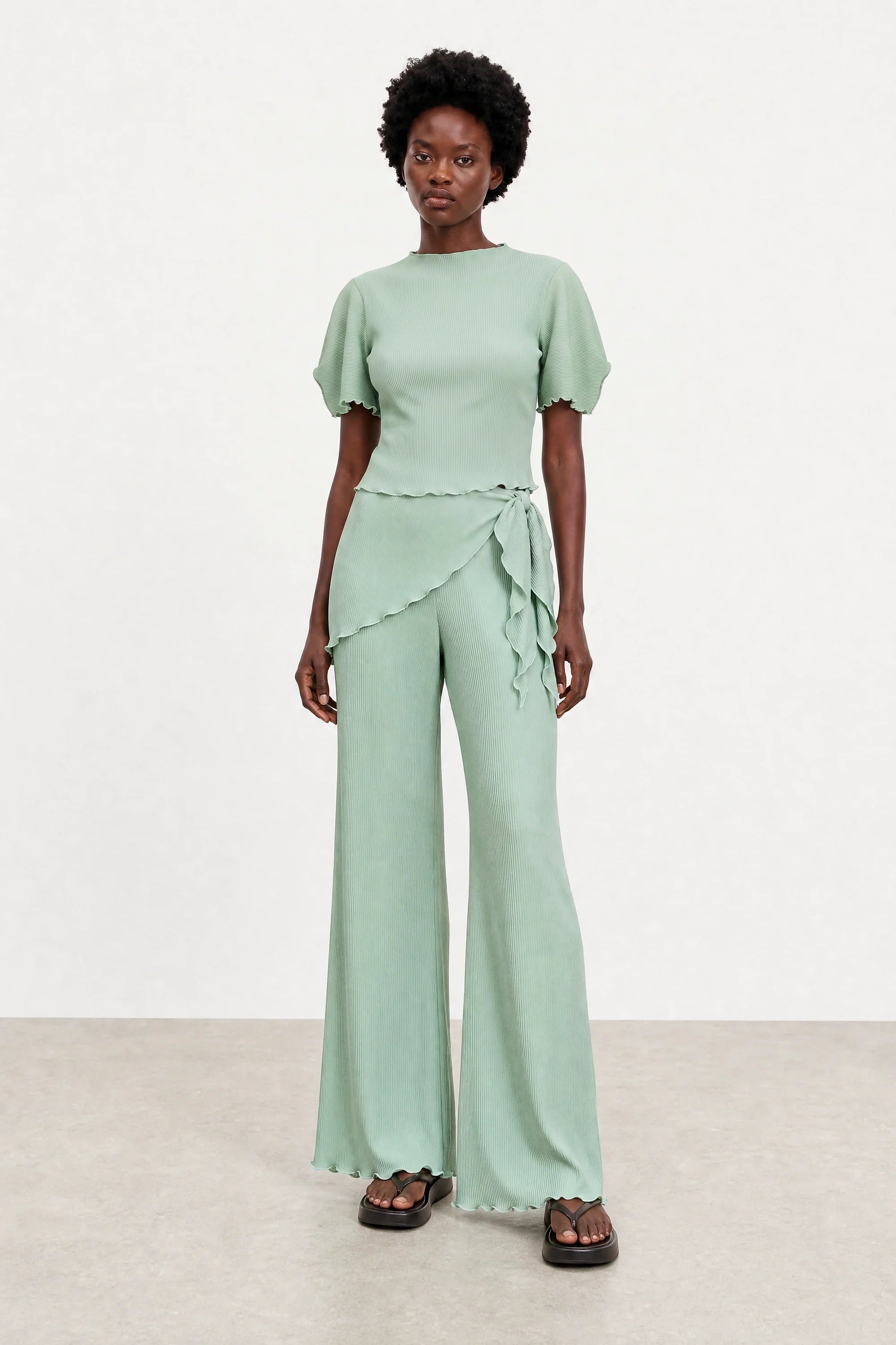 Green blue ribbed flare trousers