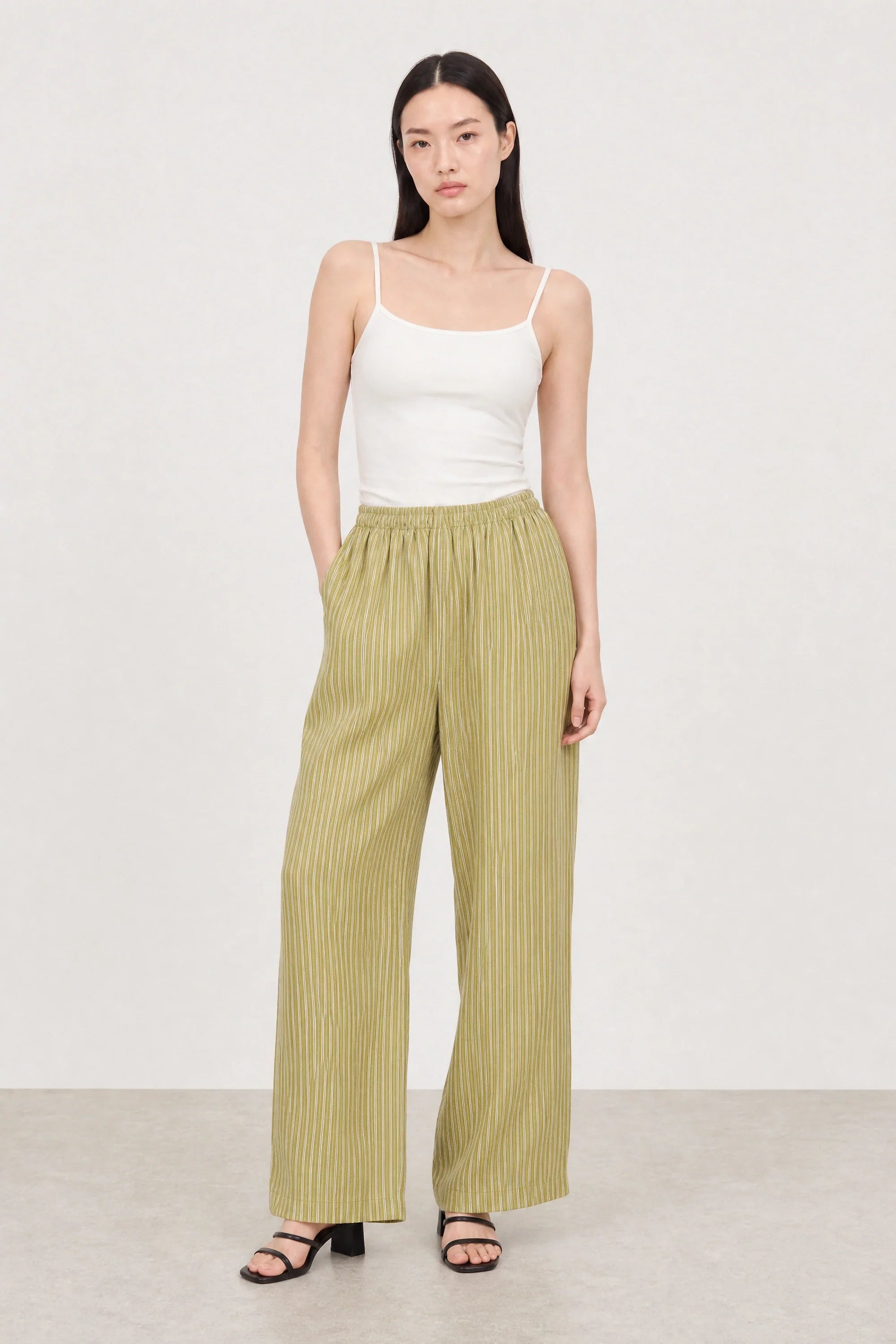 Olive green and white vertical striped relaxed trousers