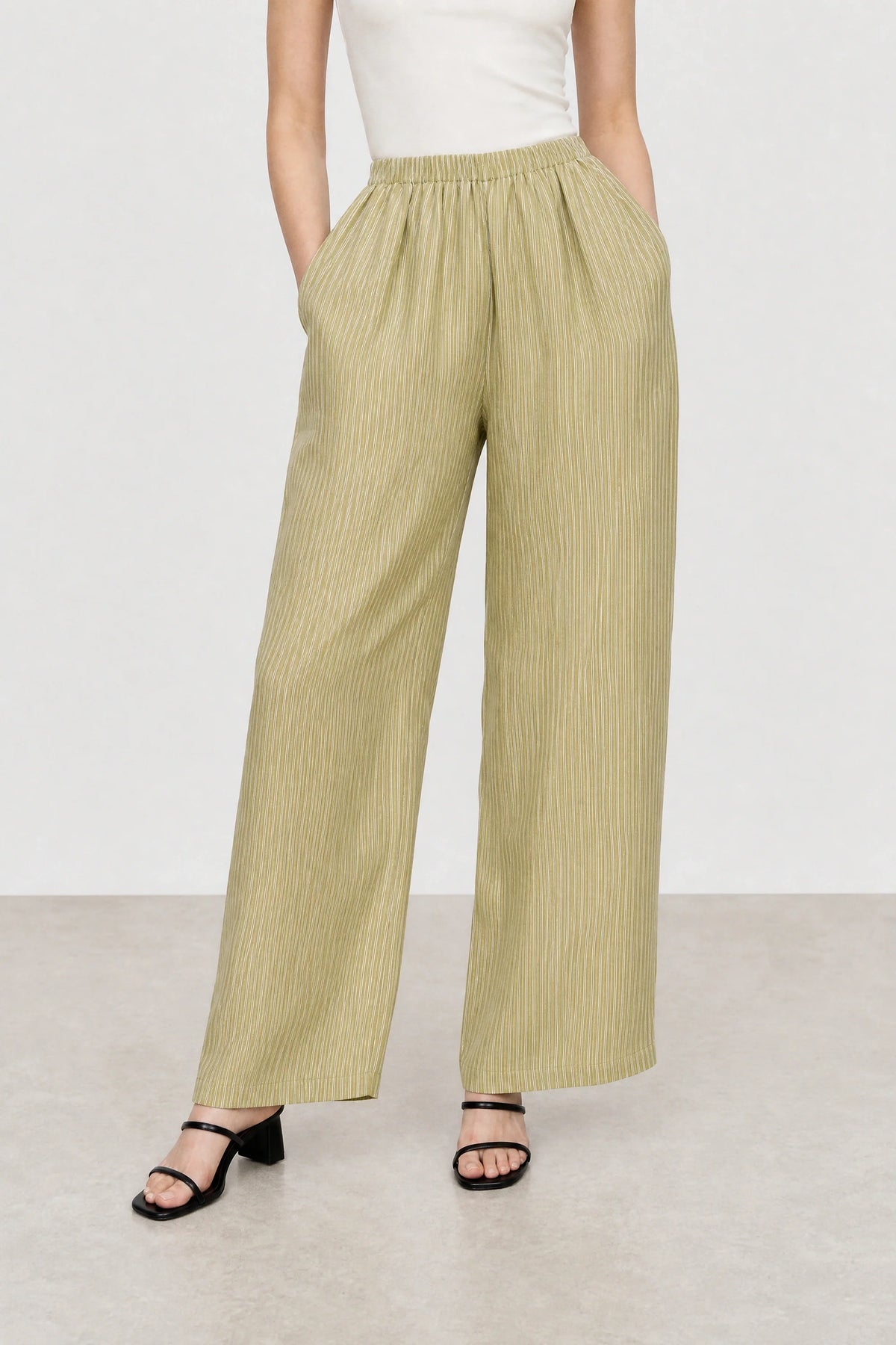 Olive green and white vertical striped relaxed trousers